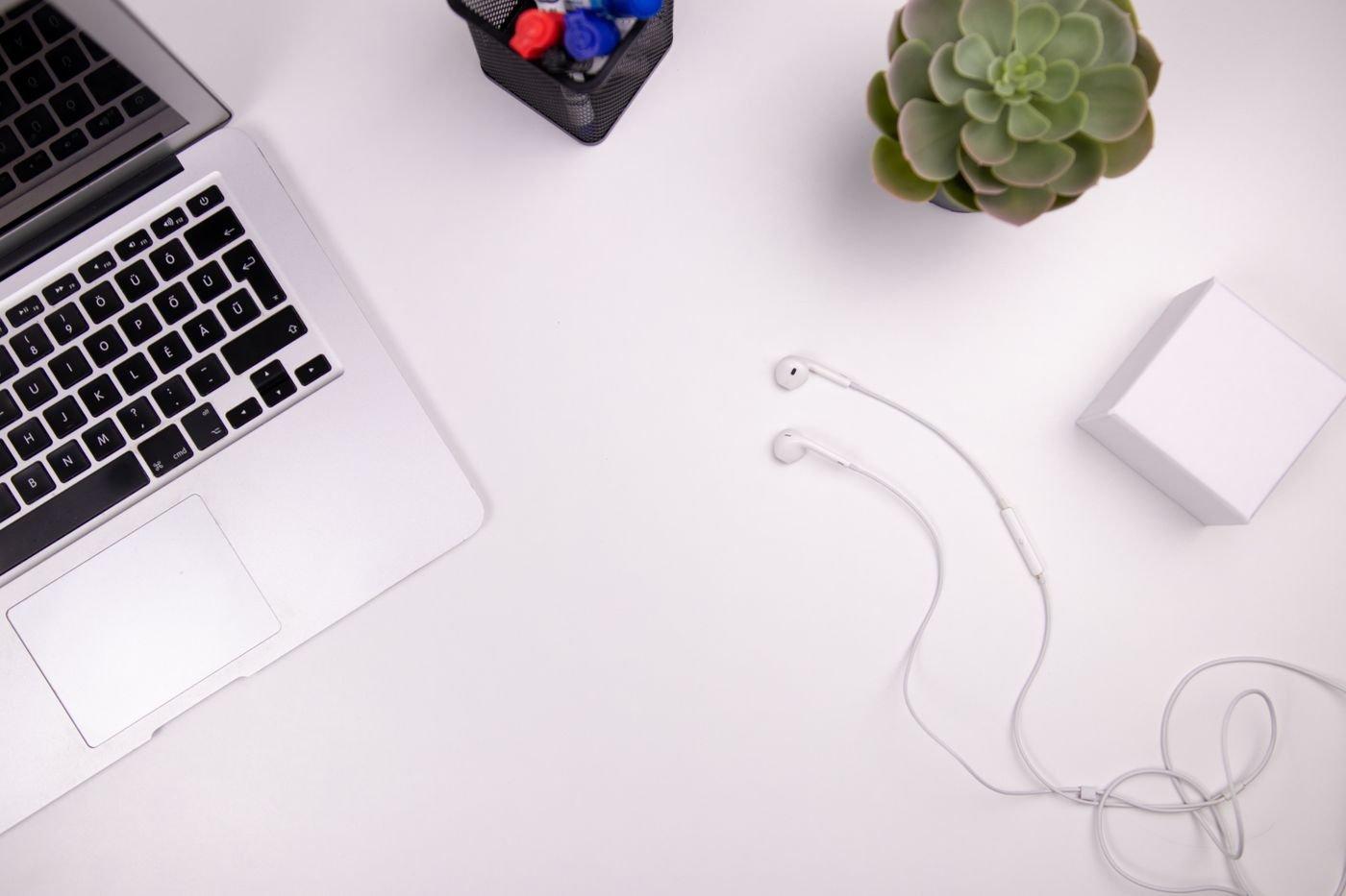 A virtual assistant and business owner collaborating at a shared workspace