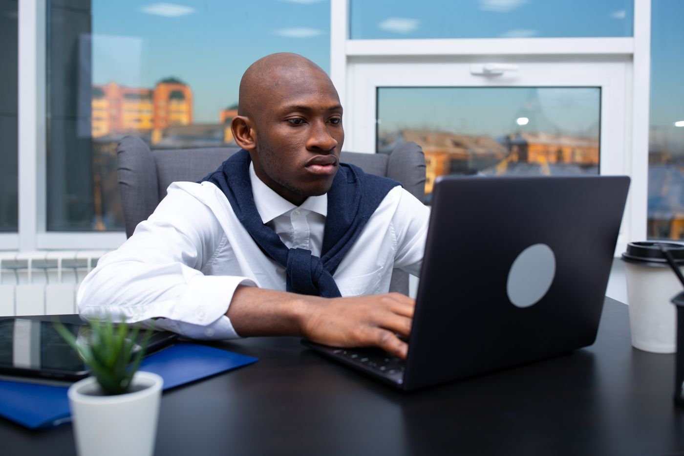 Two professionals collaborating at a workstation